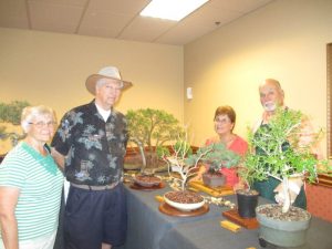 Charles and Janice Hoffman learning the art of Bonsai from Darry and Paul Bova.