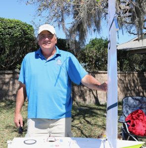 David Brawner shows off his radio controlled model sail boat. He won the first three qualifying heats Sunday morning