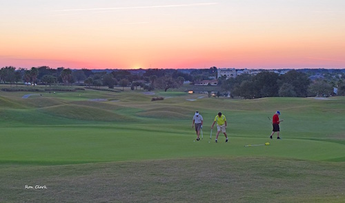 Golfers at sunset on Truman Executive Golf Course