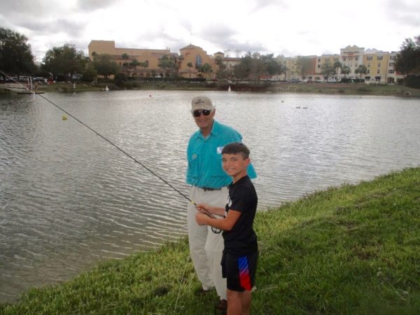 Grandson Nick LaFever getting a lesson from Dave Ferris.