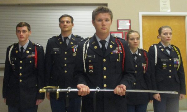 Cadet Color Guard: Andrew Horne, Matthew Duncan, Blake Yandle, holding sword, Elena Lee and Cacy Sutherby.