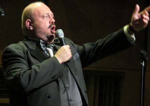 Maestro Bill Doherty left the piano and stepped in front of a microphone.