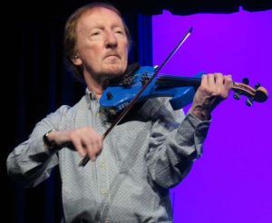 Mik Kaminski played a blue violin to add to the rich ELO sound.
