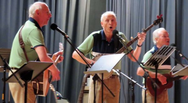 Playnfoke with Tom Lefevre, Jack Strite and Bill McGaughey played folk music songs.