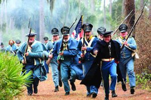 Re-enactors take part in a re-enactment of the fateful battle at the Dade Battlefield.