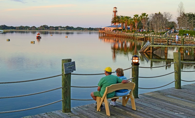 Ron Clark - Couple enjoying sunset from Lake Sumter Landing Boardwalk