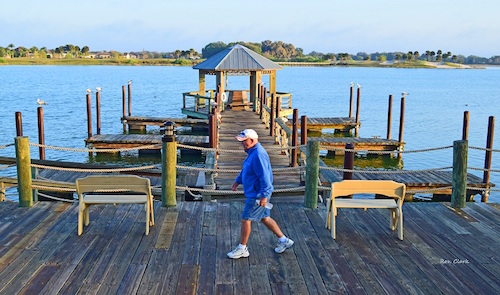 A Villager enjoying the boardwalk at sunrise in The Villages