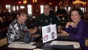 Deputy Christopher Rafferty, center, with Villagers Lois Schwartz, left, and Elaine Hirschfeld. 