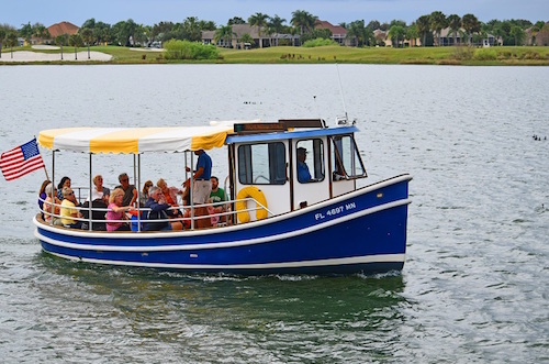 Folks enjoying Lake Sumter by boat in The Villages