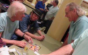 Villager Gary Davis right talks with Yardbirds Jim McCarty left and Kenny Aaronson.