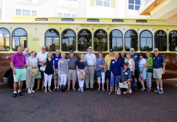 A portion of the sixty people attending heading out for a tour of The Villages.