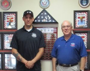Army Staff Sergeant Shane Vincent with Villager Gary Kadow.