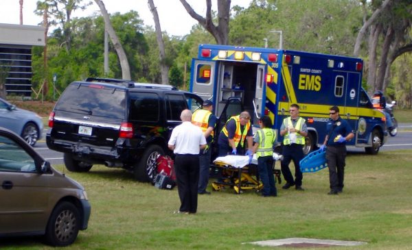 Emergency personnel prepare to transports a Lady Lake couple to a local hospital after the accident Saturday.