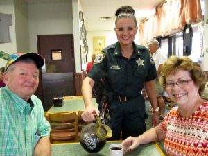Major Angelique Lochrie refilling coffee for Glenbrook residents George and Suzette Flageole.