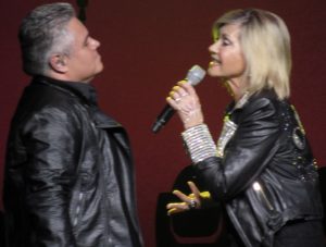 Olivia Newton-John and singer Steve Real sang a medley from the movie Grease.