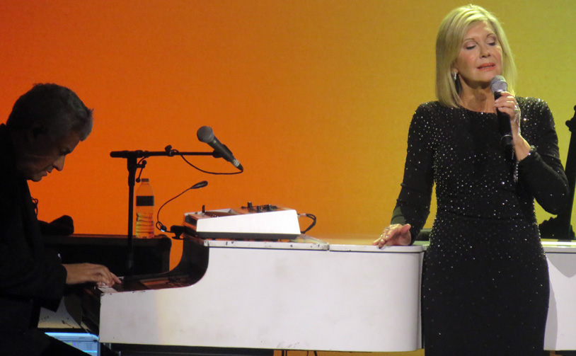 Olivia Newton-John closed the concert with "Over the Rainbow" accompanied by pianist Dane Bryant.