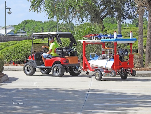 Golf cart with boat trailer ready to cross Morse Bridge