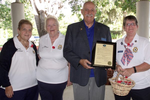 Lady Lake Mayor Jim Richards has declared Poppy Days on May 26 and 27. Present for the proclamation were American Legion Auxiliary members, from left, Carol Prione Udell, Mary La Noce and Lois Glosch.