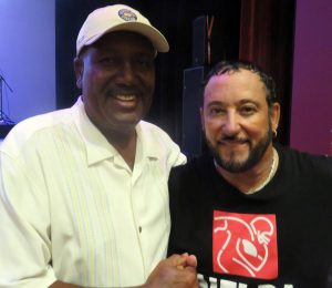 Sydney Justin, right, and former NFL quarterback James Harris in The Sharon. Justin is now lead singer of the Miracles and once played for the Rams and performed here Wednesday.