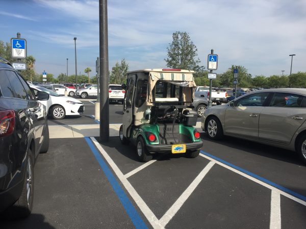 The cart in the handicap parking only had a reasonable accommodation wrap and no handicap tag