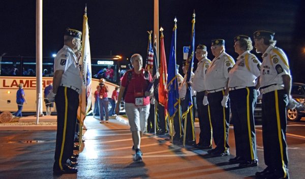 Villages Honor Flight MIssion Director Debbie Diroff gets off the bus at American Legion Post 347 after the trip