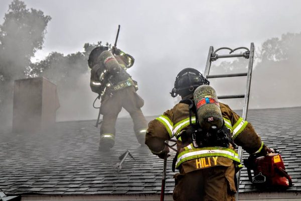 Firefighters on the roof a Hampton Manor Assisted Living Facility.