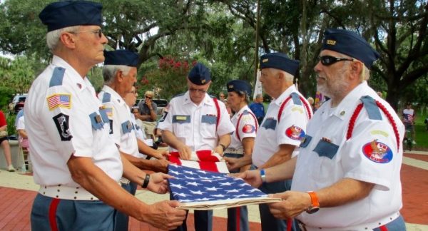 Flag folding by the Veterans Memorial Park of the Villages Honor Guard.