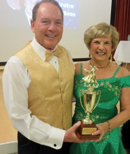 JIm and Carolyn Hutchens show off their Dancing With Our Stars trophy.