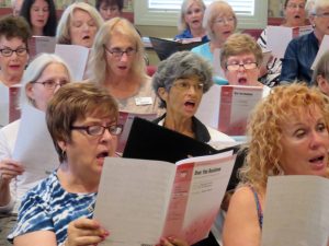 Karen Martin, center second row, rehearsing Saturday with The Villages Pops Chorus.