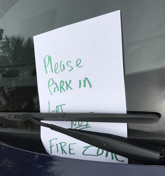 Note left in window for car in fire lane at Rohan Recreation Center.