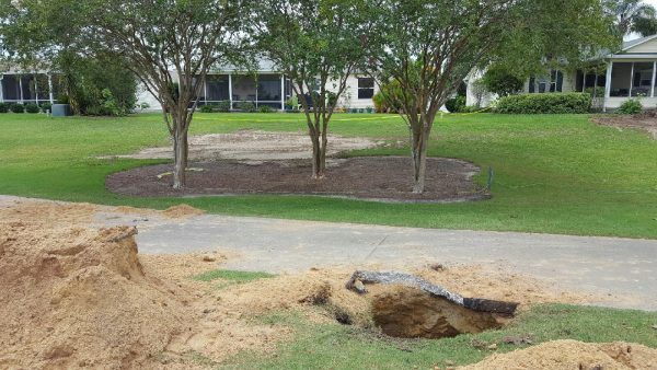 Residents of the Village of Belle Aire have watched sinkholes reopening.