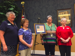Bonnie Miller, right of the Braille Flag, was honored by members of the John Bartram Chapter of the DAR