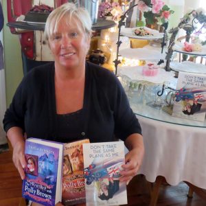 Tricia Bennett displays some of the books she has written for sale at Polly's Tearoom.