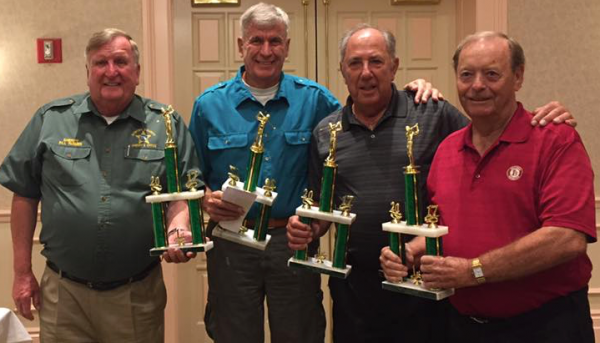 Sumter County Sheriff Bill Farmer congratulates the winners of his annual golf tourney.
