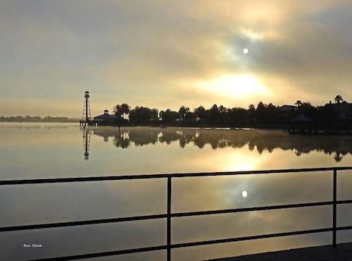 A foggy sunrise over Lake Sumter in The Villages
