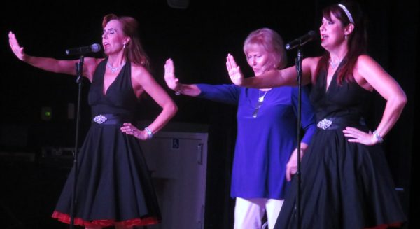 JoAnn Harrigan, center, joins the Gigi's singing the Supremes "Stop In the Name of Love."