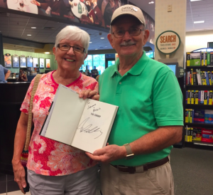 Villagers Phyllis and Don Jessup present their signed copy of the brand new book.