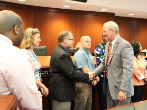 Lake County Chairman shakes hands with Chief Probation Officer Tony Deaton,