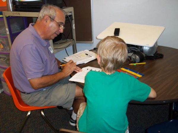Robert Bernardo tutors a child in the Tutors for Kids program.