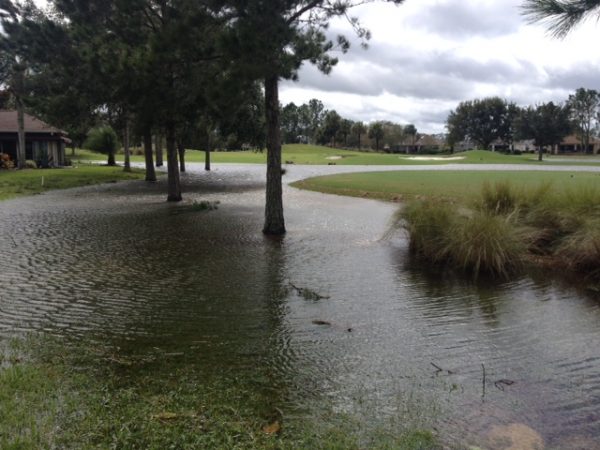 Flooded eighth hole of El Santiago Golf Course