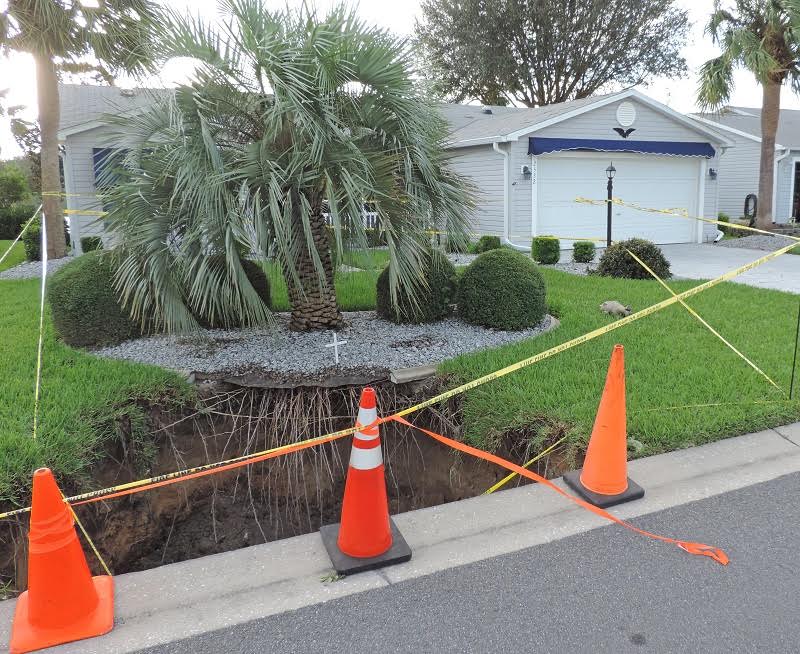 Yellow tape marks off a sinkhole in the Village of Alhambra