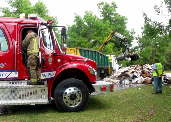 Firefighters respond to fire in trash truck on Rolling Acres Road ...