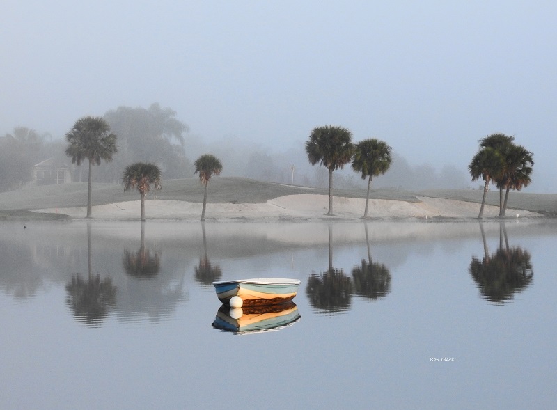 Reflections on Lake Sumter on a Foggy Morning