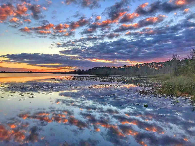 sunrises over water