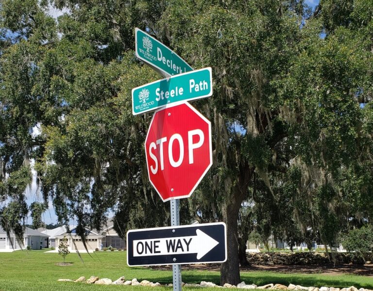 The stop sign at the intersection of DeClerk Loop and Steele Path