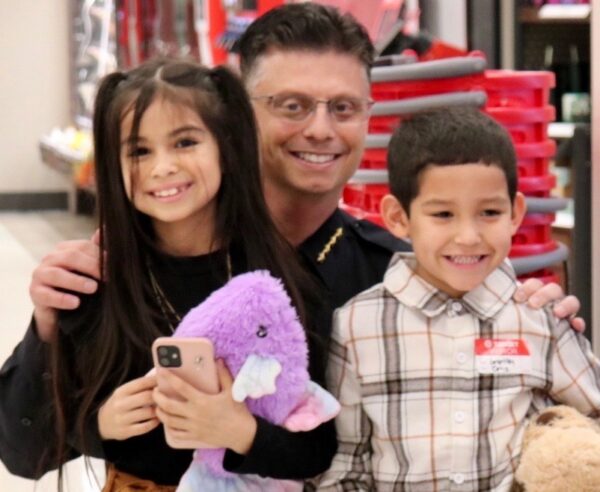 Lady Lake Police Chief Robert Tempesta with some young holiday shoppers