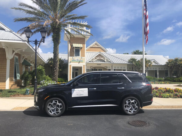 An empty car parked at SeaBreeze Recreation Center by a Properies of The Villages representative