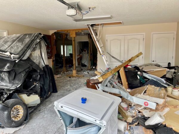 The garage of the home and its interior sustained serious damage in the crash.