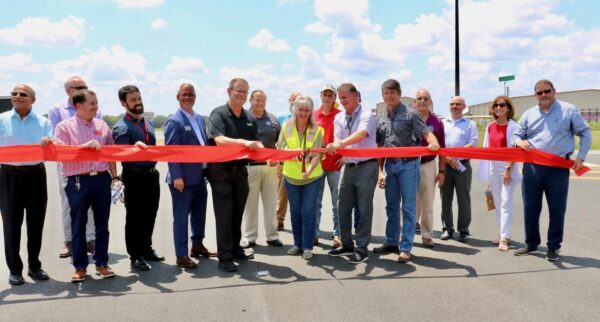 Officials joined with representatives of businesses that will benefit from the roadway expansion, including The Villages Daily Sun and DZ Block.