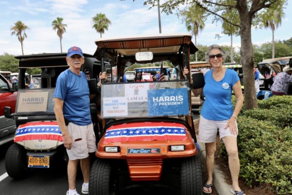 Villagers Will Vermailya and Carol Fortune were excitated to be in the parade supporting VP Harris for President